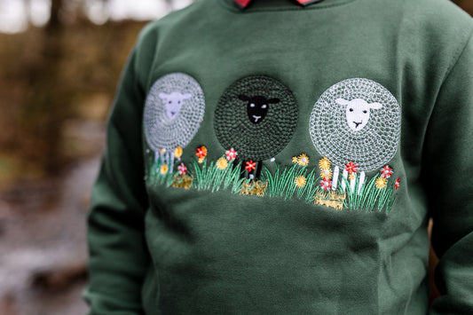 Sheep detailing on the green sweatshirt